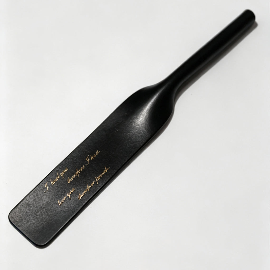 Black leather riding crop with custom gold engraving example – personalized text vegetable tanned handmade BDSM
