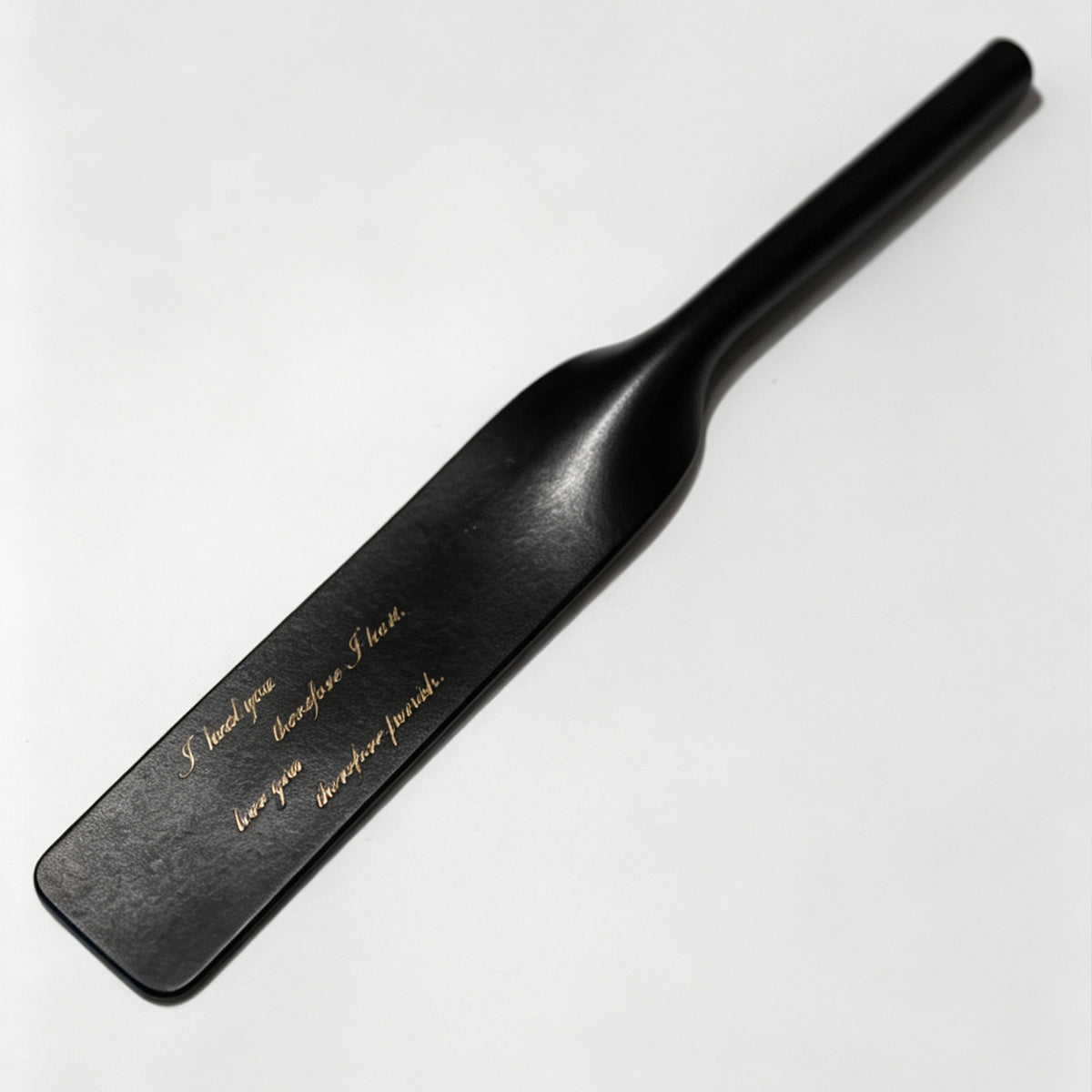 Black leather riding crop with custom gold engraving example – personalized text vegetable tanned handmade BDSM
