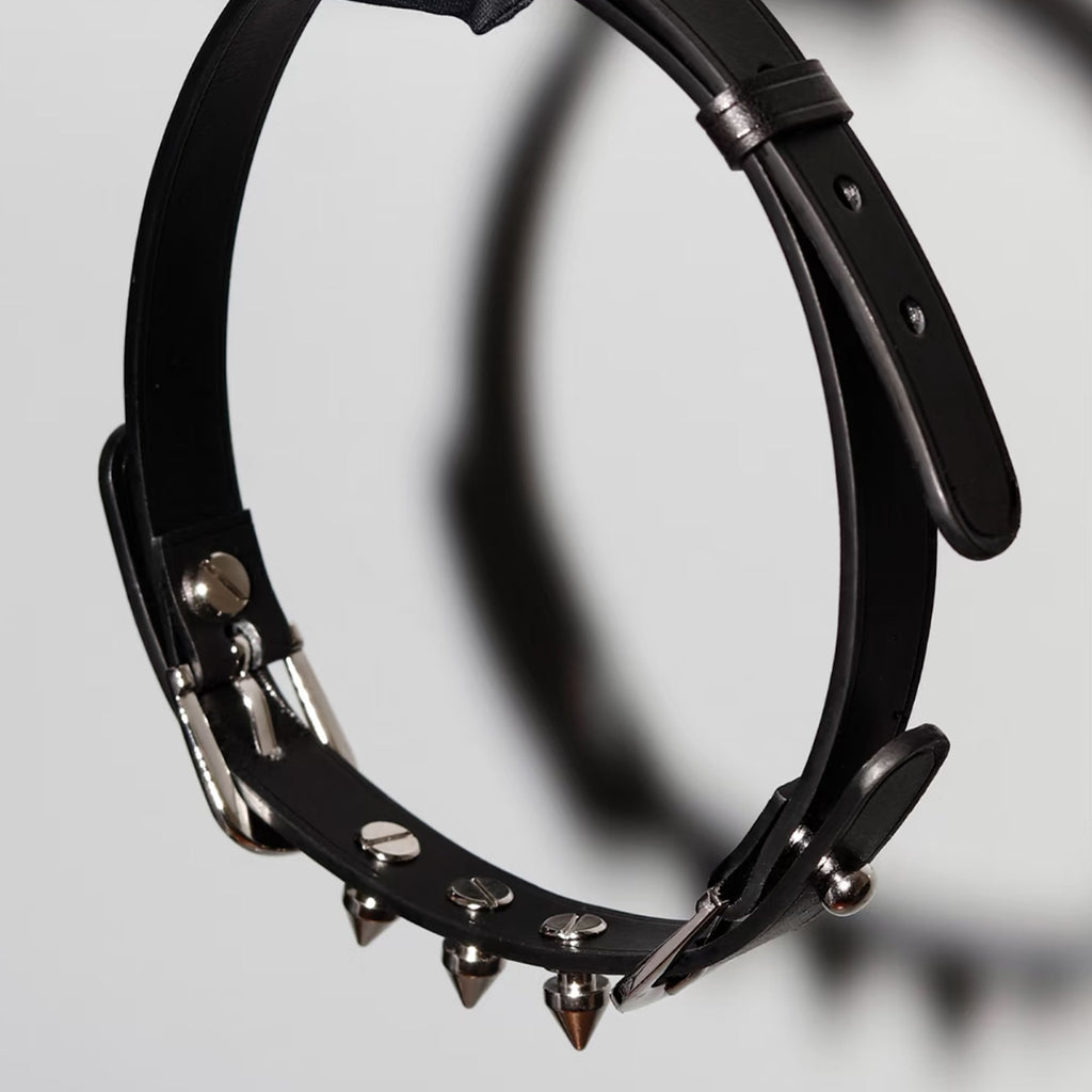Matte black leather spiked choker hanging view – silver cone rivets double buckle BDSM collar side profile

