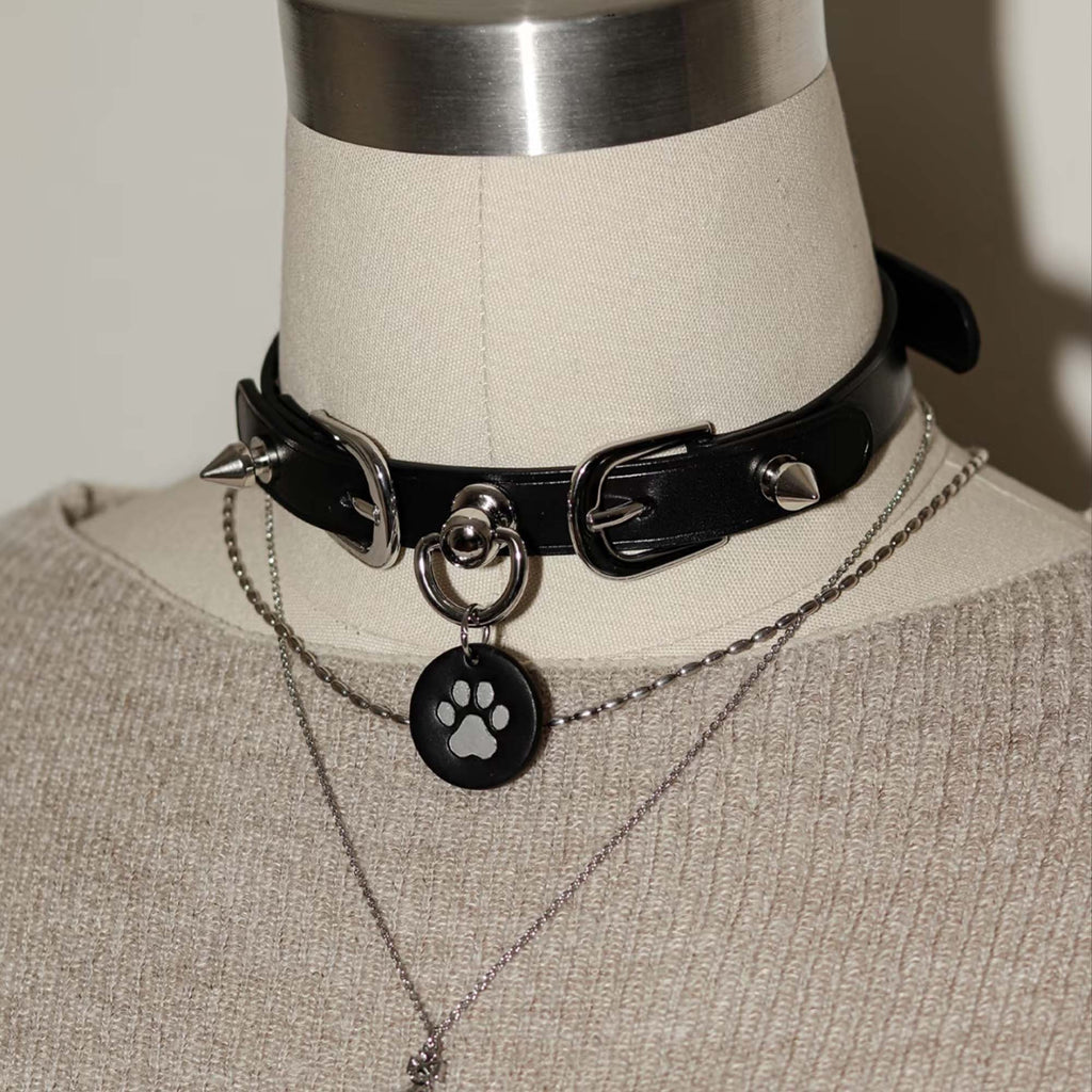 Black leather spiked choker on mannequin – silver hardware cone rivets custom tag pendant BDSM collar petplay

