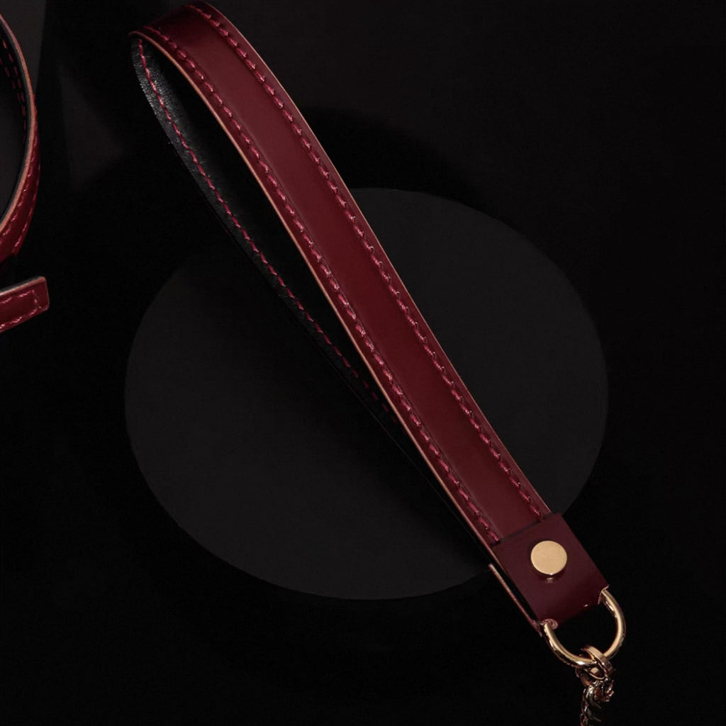 Burgundy leather leash strap detail – red saddle stitching gold dome rivet O-ring connector handmade
